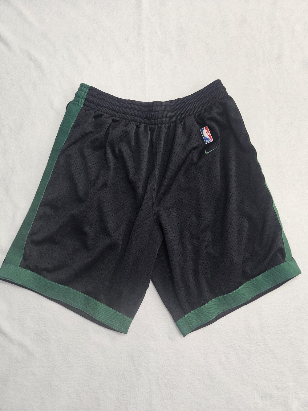 Nike Men's Black Athletic Shorts with Green Side Panels